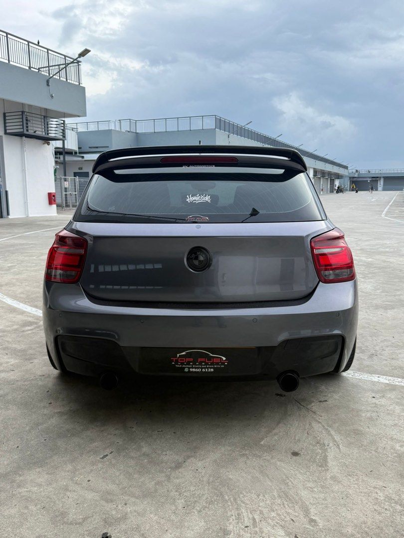 BMW 1 Series Hatchback 116i 5dr Urban (A) (Category: Used Cars) located in Singapore. Submitted by hariraga05 (Listing ID 1426516964, Image 3). Description: > 1.6L turbocharged engine, 8 speed automatic transmission, dual zone climate control, cruise control, parking sensors, auto headlights. > Full M-Sport bodykit, aftermarket big brake kit, carbon side mirror and spoiler, M-Sport steering wheel, VF engineering 18 inch rims, Android player. > A 