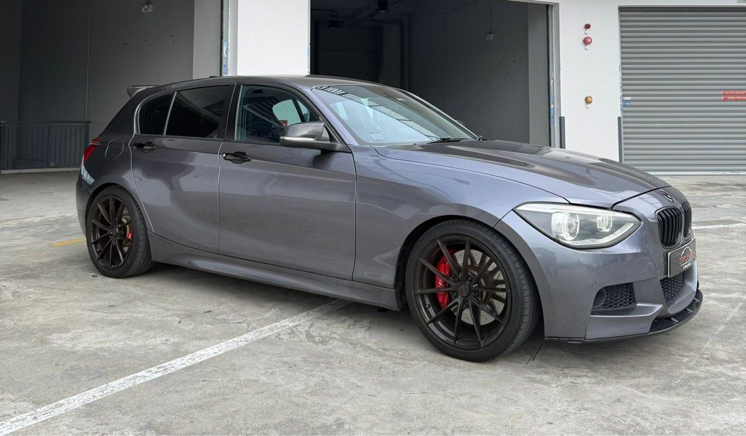 BMW 1 Series Hatchback 116i 5dr Urban (A) (Category: Used Cars) located in Singapore. Submitted by hariraga05 (Listing ID 1426516964, Image 2). Description: > 1.6L turbocharged engine, 8 speed automatic transmission, dual zone climate control, cruise control, parking sensors, auto headlights. > Full M-Sport bodykit, aftermarket big brake kit, carbon side mirror and spoiler, M-Sport steering wheel, VF engineering 18 inch rims, Android player. > A 