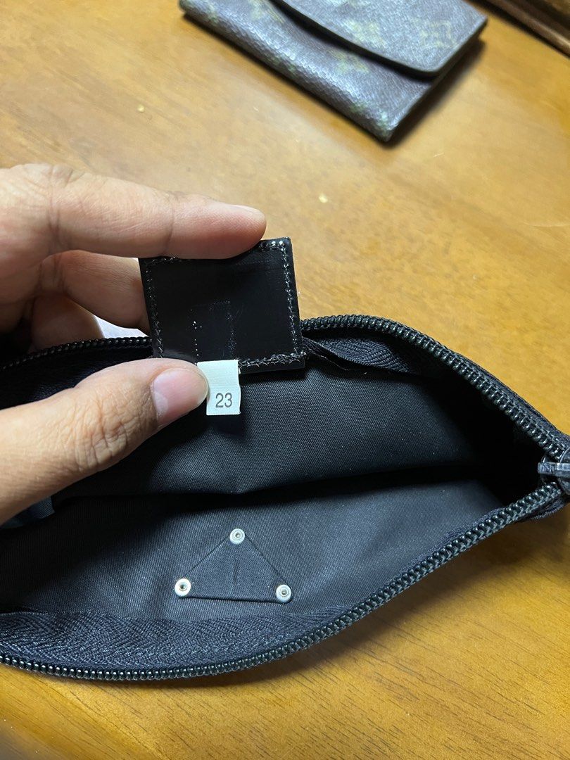 Celine Clutch, Louis Vuitton Wallet, Prada Pouch (Category: Luxury Bags & Wallets) located in Valenzuela. Submitted by 3ssiastansachajapansurplus (Listing ID 1426514440, Image 2). Description: Set includes a Celine clutch, a Louis Vuitton wallet, and a Prada pouch. The Celine clutch features a monogram pattern and a flap closure. The Louis Vuitton wallet is a small, bi-fold design with a monogram pattern. The Prada pouch is black with a zipper cl