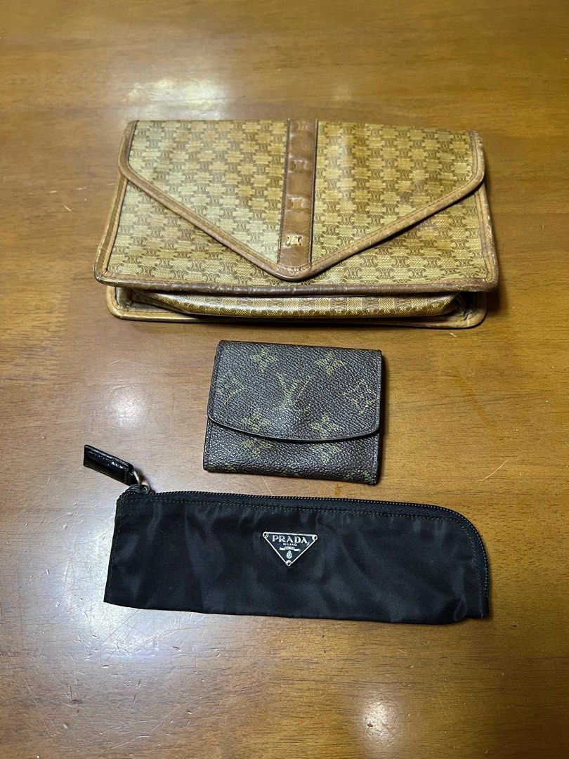 Celine Clutch, Louis Vuitton Wallet, Prada Pouch (Category: Luxury Bags & Wallets) located in Valenzuela. Submitted by 3ssiastansachajapansurplus (Listing ID 1426514440, Image 1). Description: Set includes a Celine clutch, a Louis Vuitton wallet, and a Prada pouch. The Celine clutch features a monogram pattern and a flap closure. The Louis Vuitton wallet is a small, bi-fold design with a monogram pattern. The Prada pouch is black with a zipper cl