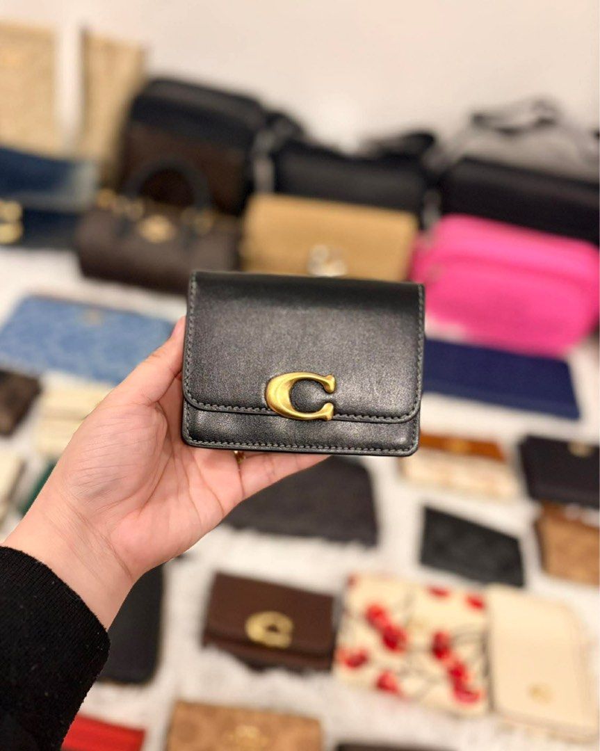 Coach bandit (Category: Luxury Bags & Wallets) located in Manila. Submitted by luxwalletbags (Listing ID 1426534460, Image 3). Description: - Coach Bandit Small Wallet - Compact design - Features the iconic 'C' logo - Available in multiple colors.