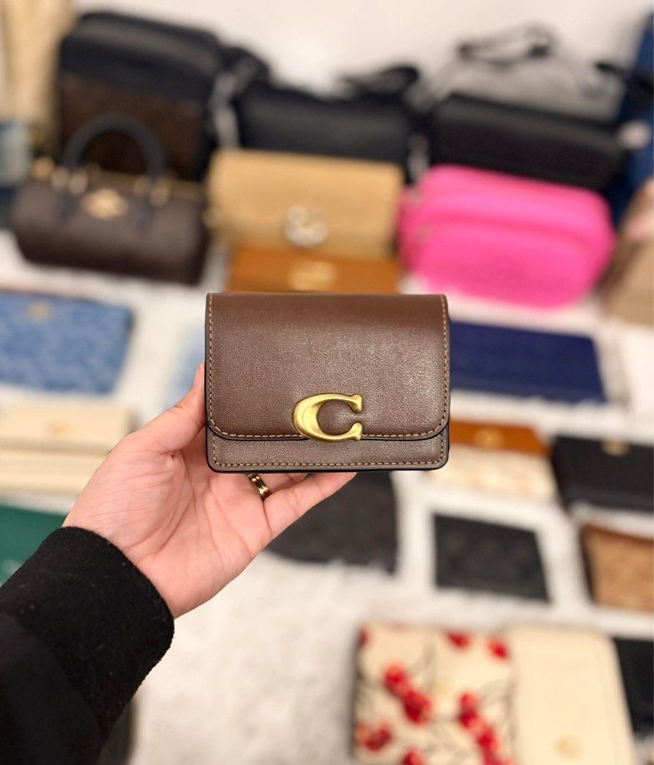 Coach bandit (Category: Luxury Bags & Wallets) located in Manila. Submitted by luxwalletbags (Listing ID 1426534460, Image 1). Description: - Coach Bandit Small Wallet - Compact design - Features the iconic 'C' logo - Available in multiple colors.