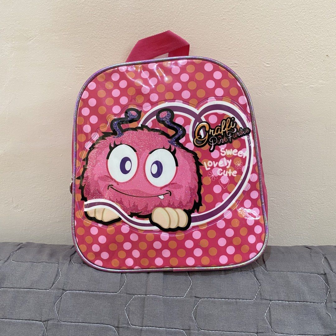 Cute Kids Small Backpack - Graffi brand (Category: Other Babies Going Out Needs) located in Imus. Submitted by shopfromlilo (Listing ID 1426508193, Image 1). Description: Well-used. Please manage expectations. Needs washing. Imus Cavite location. Lalamove or J&T. #kidsbag #kidsbackpack #graffibag #kidspinkbag.