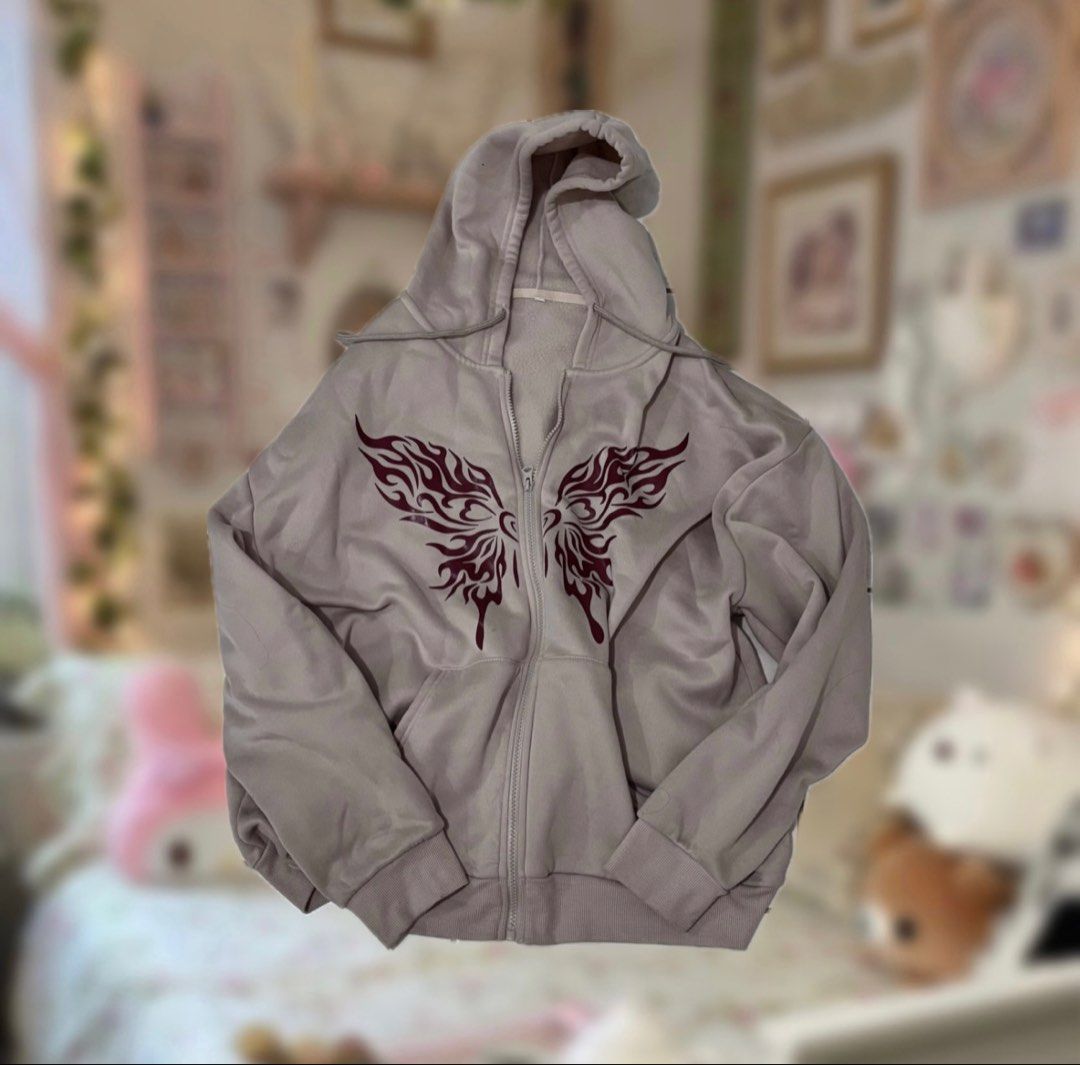 cyber butterfly oversized hoodie (Category: Coats, Jackets and Outerwear) located in Manila. Submitted by sofiaax (Listing ID 1426412122, Image 1). Description: -size is xl but is perfectly baggy for size s people ! -color: beige brown while the print is dark maroon payment: gcash onlyy delivery: j&t or lalamove :) tags: y2k cyber grunge streetwear butterfly graphic zip hoodie pinterest style oversized acubi cybercore skatergirl tribal alt .