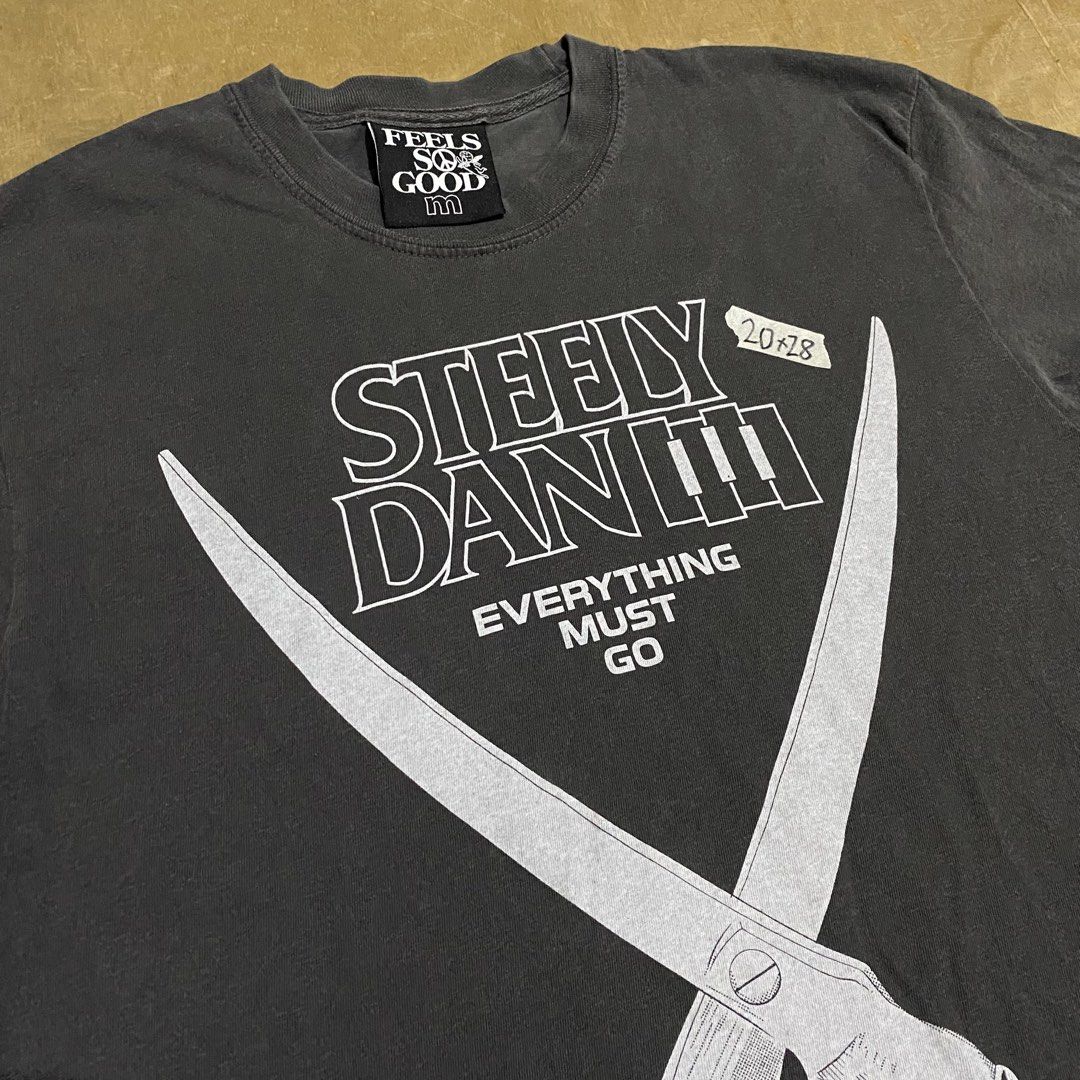 Feels So Good Steely Dan III T-shirt (Category: Tshirts & Polo Shirts ) located in Makati City. Submitted by kktrippy (Listing ID 1426475439, Image 2). Description: - Feels So Good Steely Dan III T-shirt - Size: M - Features a unique graphic design rip off on black flag - Perfect for Steely Dan fans.