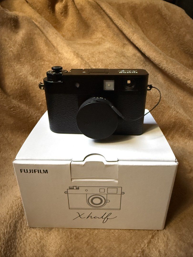 Fujifilm X-half Camera (Category: Cameras) located in San Juan City. Submitted by bjmoreno (Listing ID 1426479384, Image 1). Description: Fujifilm Xhalf Compact Digital Camera - Pristine condition - Comes with original box and manual - Model: FX-HF1S WW1 C - Wifi / Bluetooth - NO ISSUES - NO DENT Complete package. No dents, no issues. Rarely used and in excellent condition. RFS: Upgrading to a new high-end Fujifilm camera. 📷 .