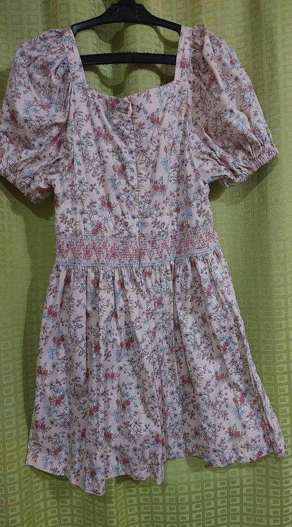 Gingersnaps Floral Dress (Category: Babies & Kids Fashion) located in Rizal. Submitted by zhellieme (Listing ID 1426516994, Image 2). Description: Gingersnaps dress features a beautiful floral print. It has a square neckline and short, puffy sleeves. The dress has a smocked bodice and a flared skirt. The size tag indicates it is a size 14. chest 13, length 30.
