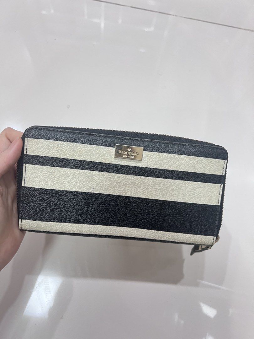 Kate Spade Striped Zip Around Wallet (Category: Wallets & Card holders) located in Manila. Submitted by offthelabelmnl (Listing ID 1426441891, Image 1). Description: Kate Spade Striped Zip Around Wallet - original bought from US outlet - used a few times and left in storage - selling low for 900 - good condition just needs cleaning - binondo loc.