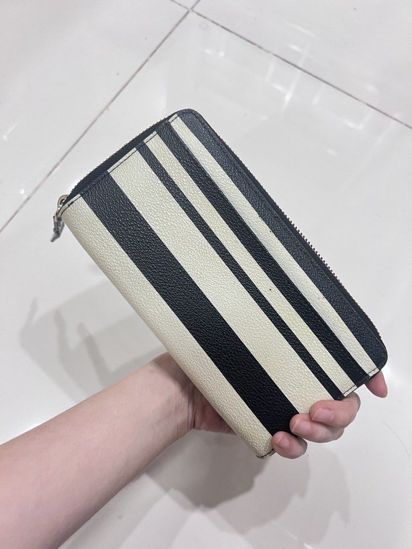 Kate Spade Striped Zip Around Wallet (Category: Wallets & Card holders) located in Manila. Submitted by offthelabelmnl (Listing ID 1426441891, Image 3). Description: Kate Spade Striped Zip Around Wallet - original bought from US outlet - used a few times and left in storage - selling low for 900 - good condition just needs cleaning - binondo loc.