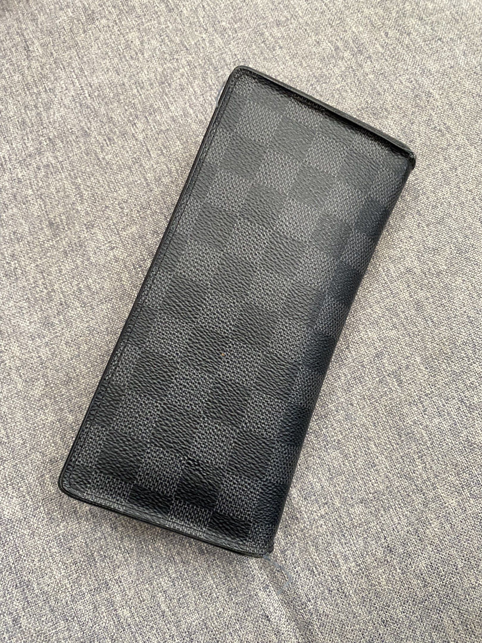 Louis Vuitton Damier Graphite Wallet (Category: Luxury Bags & Wallets) located in Santa Rosa. Submitted by happydays__ (Listing ID 1426385982, Image 1). Description: LV Damier Wallet Guaranteed Authentic Signs of use inside pocket- pls see pics (Dumikit bec just stored in bag closet) RFS: decluttering collection :) Loc: Nuvali Lalamove or LBC BPI/ Gcash Happy shopping! .