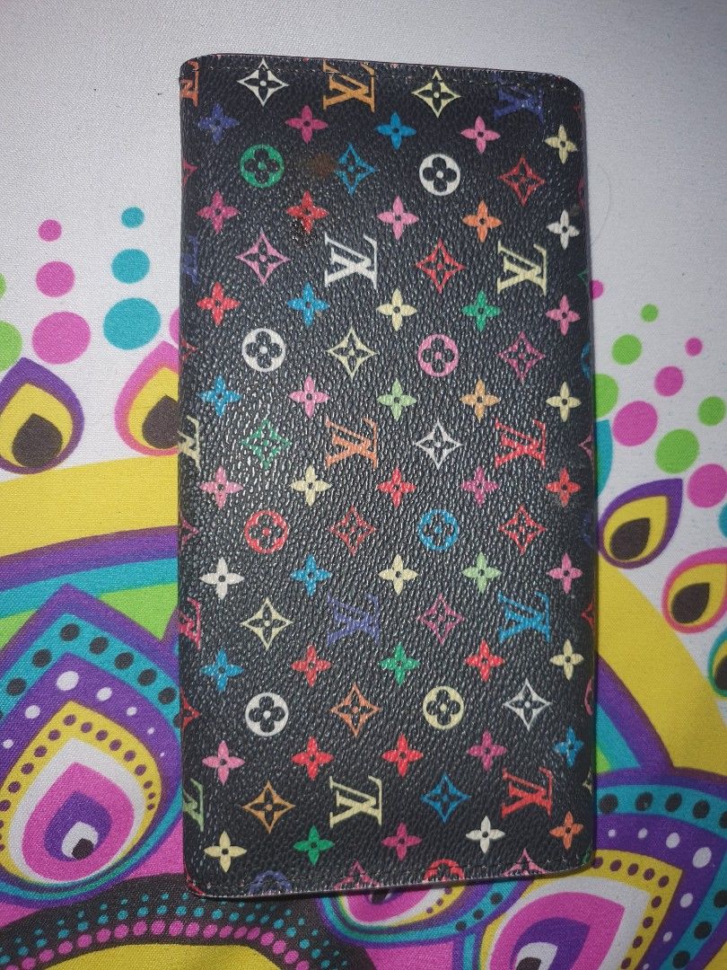 Louis Vuitton Multicolor Wallet (Category: Luxury Bags & Wallets) located in Manila. Submitted by jemiclat3076761 (Listing ID 1426551364, Image 1). Description: Authentic Louis Vuitton wallet featuring a multicolor monogram pattern on a black background. The interior is pink and includes the Louis Vuitton Paris stamp. It has multiple card slots and a snap closure..