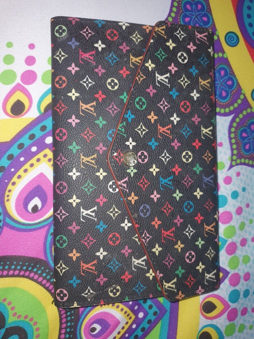 Louis Vuitton Multicolor Wallet (Category: Luxury Bags & Wallets) located in Manila. Submitted by jemiclat3076761 (Listing ID 1426552158, Image 2). Description: Louis Vuitton wallet features a vibrant multicolor monogram pattern on a black background. The wallet has a zip-around closure..