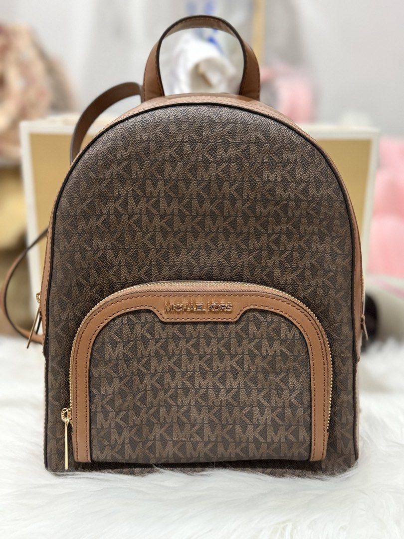 Michael Kors Signature Backpack (Category: Luxury Bags & Wallets) located in Munoz. Submitted by cndy9 (Listing ID 1426473490, Image 2). Description: Brand new Original MK backpack Medium Perfect for casual/travel .