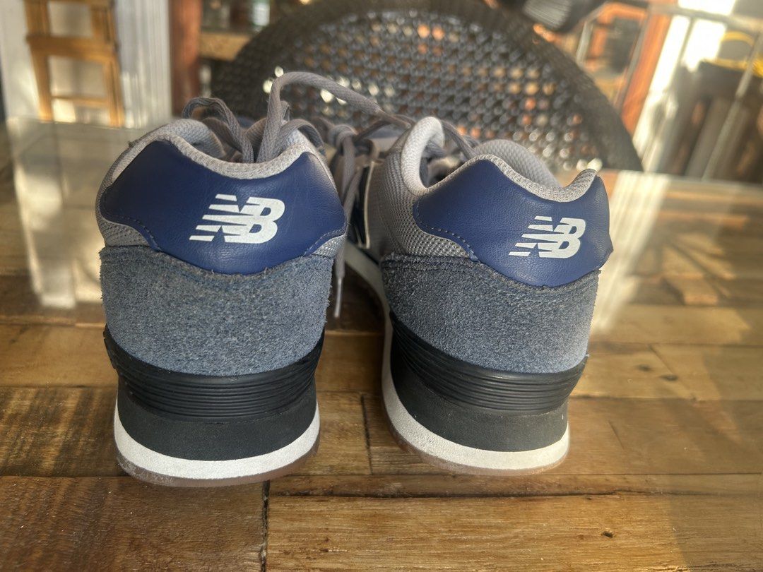 New Balance 515 Gray Sneakers (Category: Sneakers) located in Las Pinas. Submitted by tinamontec00246 (Listing ID 1426483885, Image 2). Description: New Balance 515 sneakers in gray with navy blue accents. Features a cushioned insole for comfort. The shoes have a mesh upper and a classic lace-up design. The New Balance logo is visible on the side and heel. The size is US 8.5. Made in Vietnam..