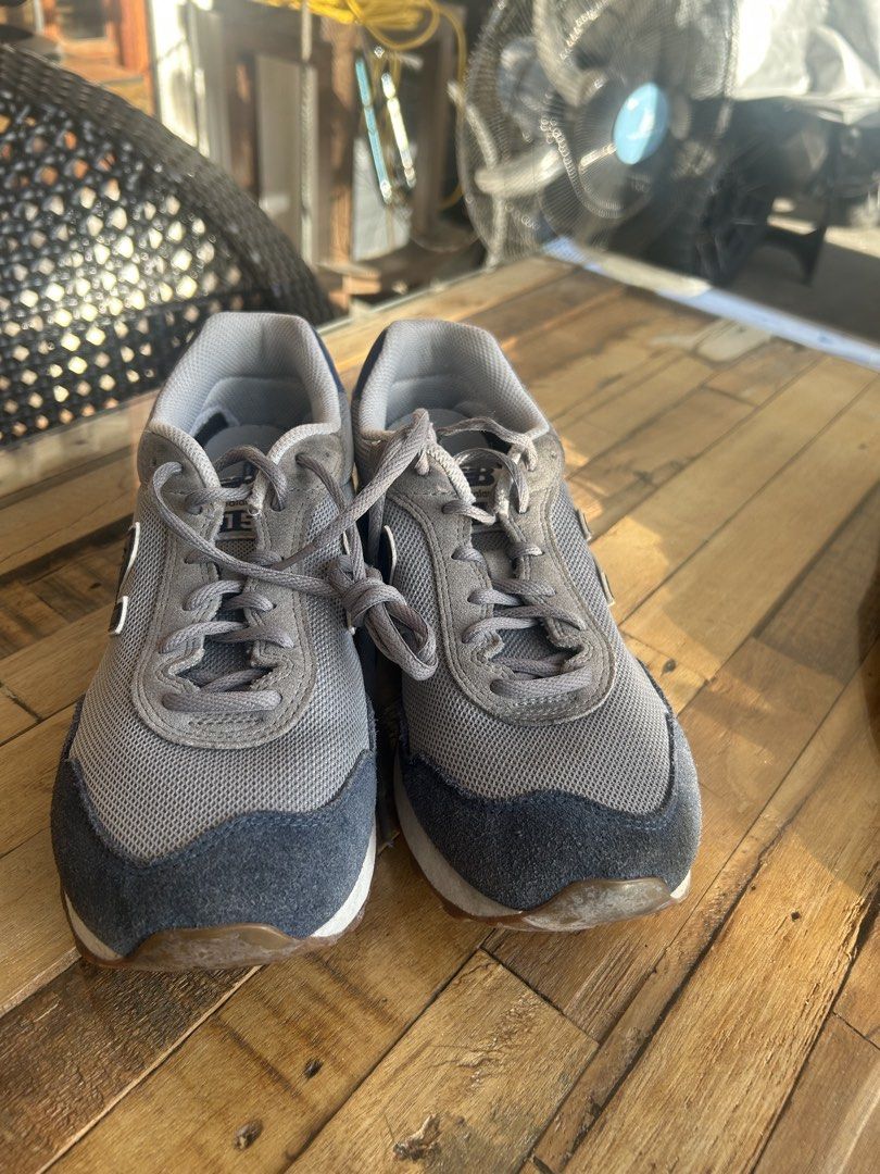 New Balance 515 Gray Sneakers (Category: Sneakers) located in Las Pinas. Submitted by tinamontec00246 (Listing ID 1426483885, Image 3). Description: New Balance 515 sneakers in gray with navy blue accents. Features a cushioned insole for comfort. The shoes have a mesh upper and a classic lace-up design. The New Balance logo is visible on the side and heel. The size is US 8.5. Made in Vietnam..