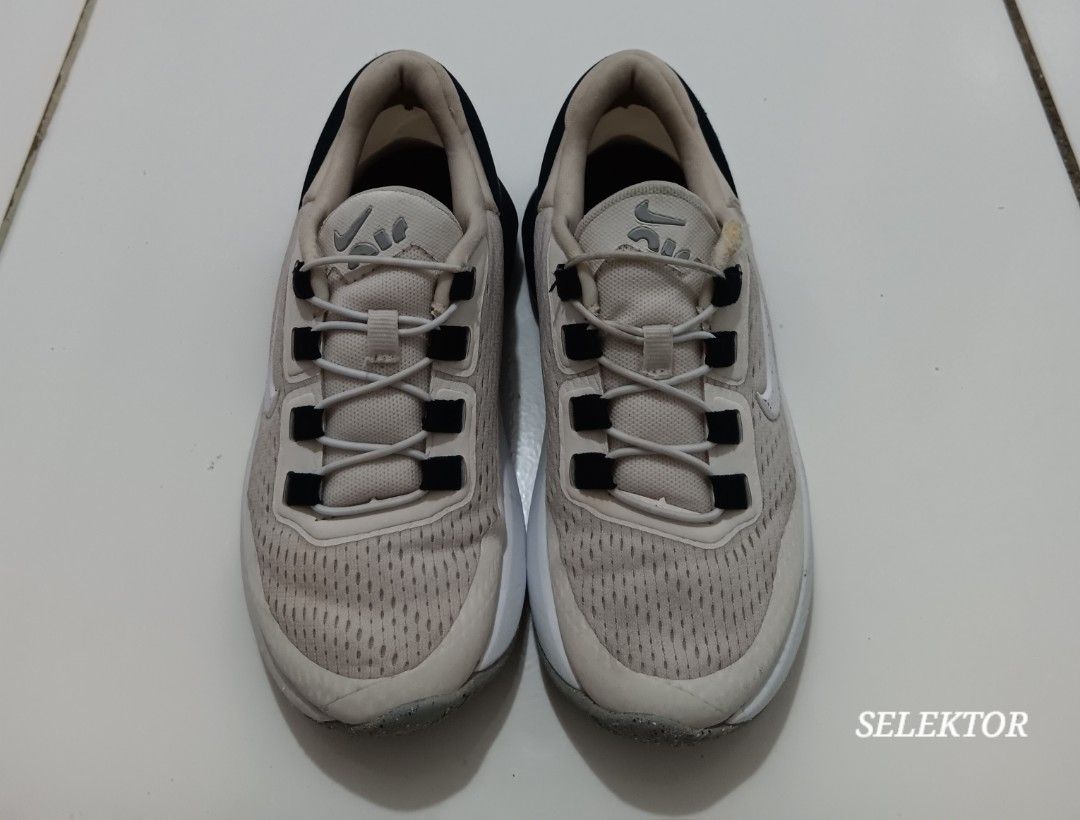 Nike Air Max 270 - Size 10.5C (Category: Babies & Kids Fashion) located in Dauis. Submitted by udenglegaspi (Listing ID 1426504016, Image 3). Description: Nike Air Max 270 sneakers in a beige and black colorway. Features a white midsole and a grey outsole. Size is 10.5C (16.5 cm). The shoes have a mesh upper with the Nike swoosh logo on the side. The shoes have black laces and a black heel counter..