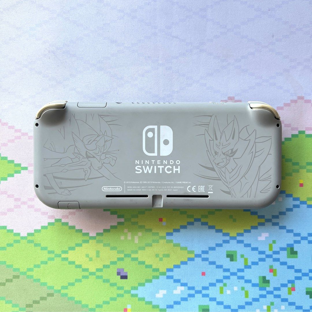 Nintendo Switch Lite Limited Edition w/ Pokemon Shield (Category: Nintendo) located in Manila. Submitted by gamejaystore (Listing ID 1426484727, Image 2). Description: For sale Switch Lite with Pokemon Shield Unit is in good condition, working all buttons and triggers, responsive touchscreen, all slots are working. Also comes with Pokemon Shield. No SD Card. Inclusion: - Switch Lite - Charger - Pokemon Shield Meetups at Ayala Malls Circuit or Sho