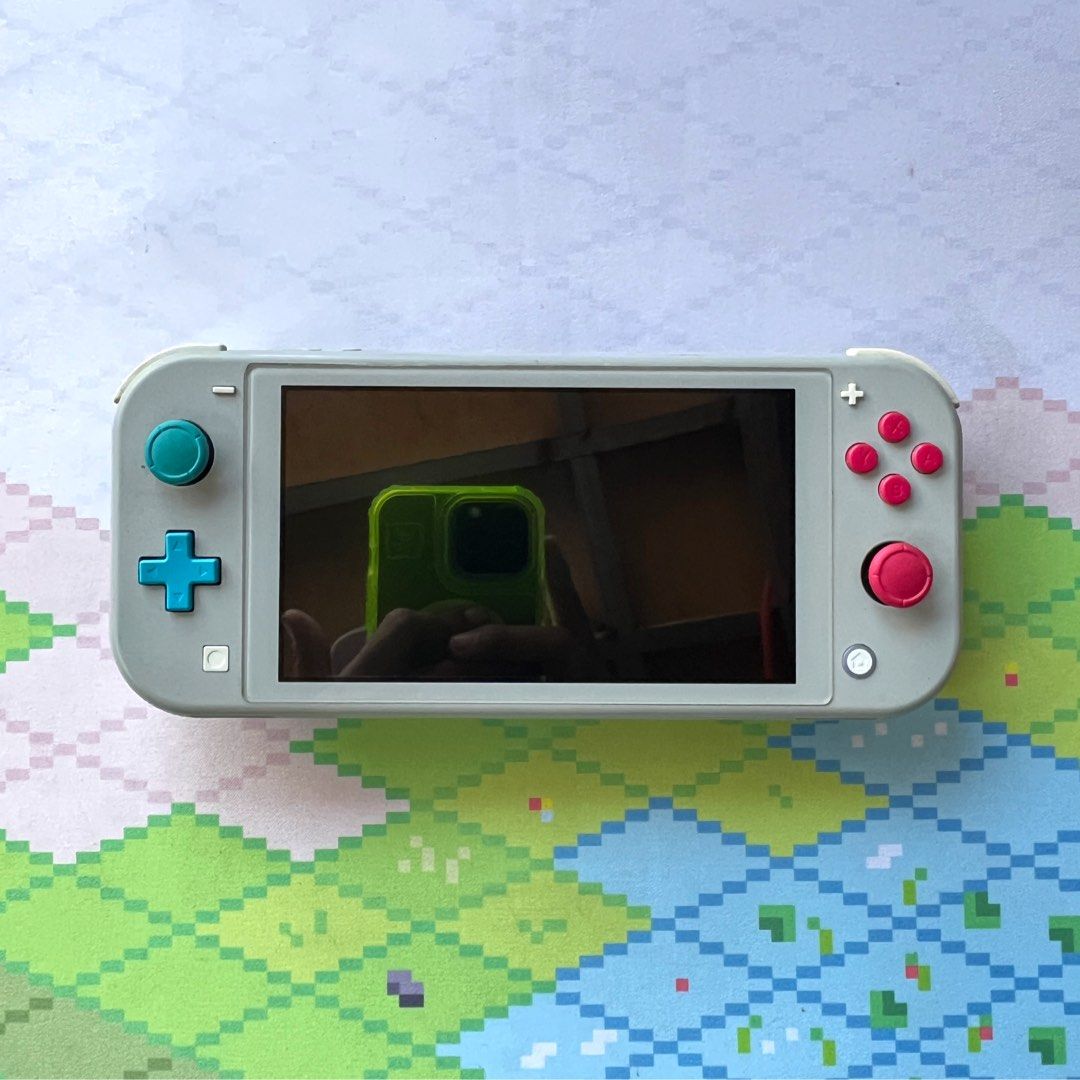 Nintendo Switch Lite Limited Edition w/ Pokemon Shield (Category: Nintendo) located in Manila. Submitted by gamejaystore (Listing ID 1426484727, Image 3). Description: For sale Switch Lite with Pokemon Shield Unit is in good condition, working all buttons and triggers, responsive touchscreen, all slots are working. Also comes with Pokemon Shield. No SD Card. Inclusion: - Switch Lite - Charger - Pokemon Shield Meetups at Ayala Malls Circuit or Sho