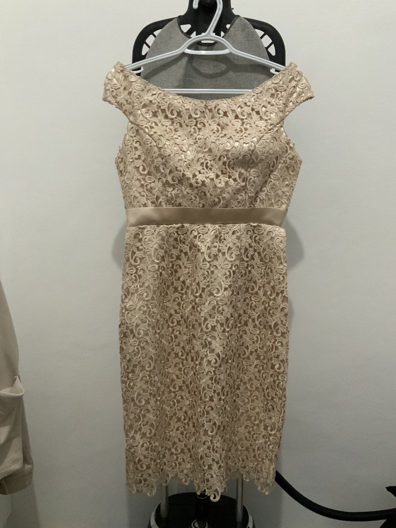 Off-Shoulder Padded Lace Beige Dress (Category: Dresses) located in Taguig. Submitted by mstyphoon (Listing ID 1426463987, Image 1). Description: Elegant off-shoulder dress in a beautiful beige lace. Features a satin ribbon detail at the waist. The dress has a fitted silhouette and falls to the knee. Perfect for special occasions like graduations. Needs wash only. Below knee-length for 5’1” height. .