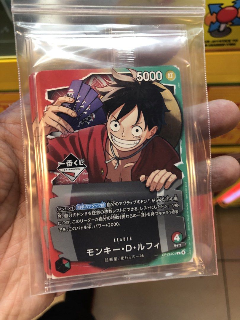 One Piece Card Game - Monkey D. Luffy Leader Card (Category: Raw Singles) located in San Juan City. Submitted by fhm.com (Listing ID 1426585342, Image 1). Description: ichiban kuji sealed luffy promo card on hand .