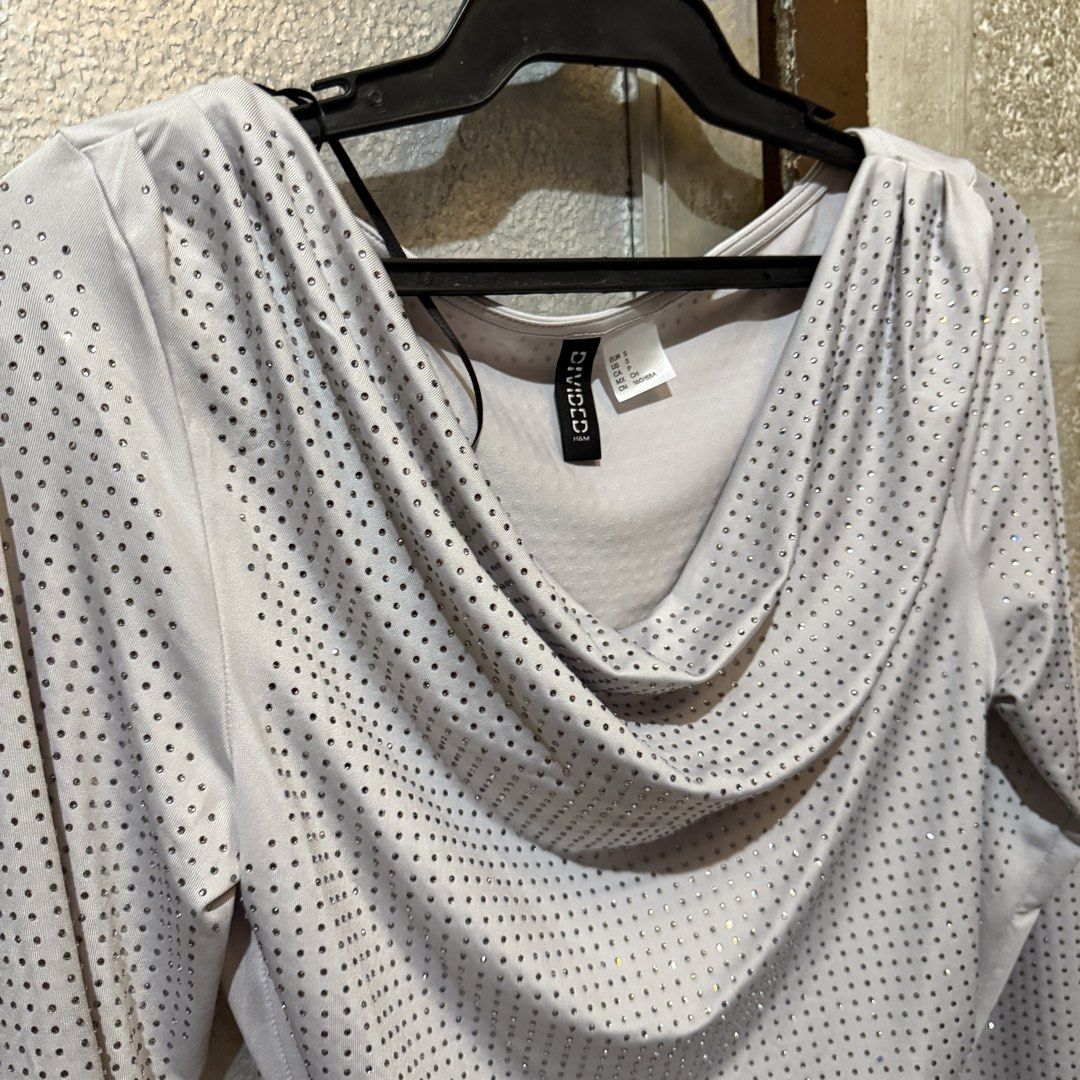 Original H&M White Long Sleeve Top with Silver Studs (Category: Longsleeves) located in Antipolo. Submitted by bern.clo (Listing ID 1426466389, Image 2). Description: • small on tag • 10/10 condition • super cute and classy • stretchable (fits up to medium body frames) • perfect for parties (glitz and glam theme).
