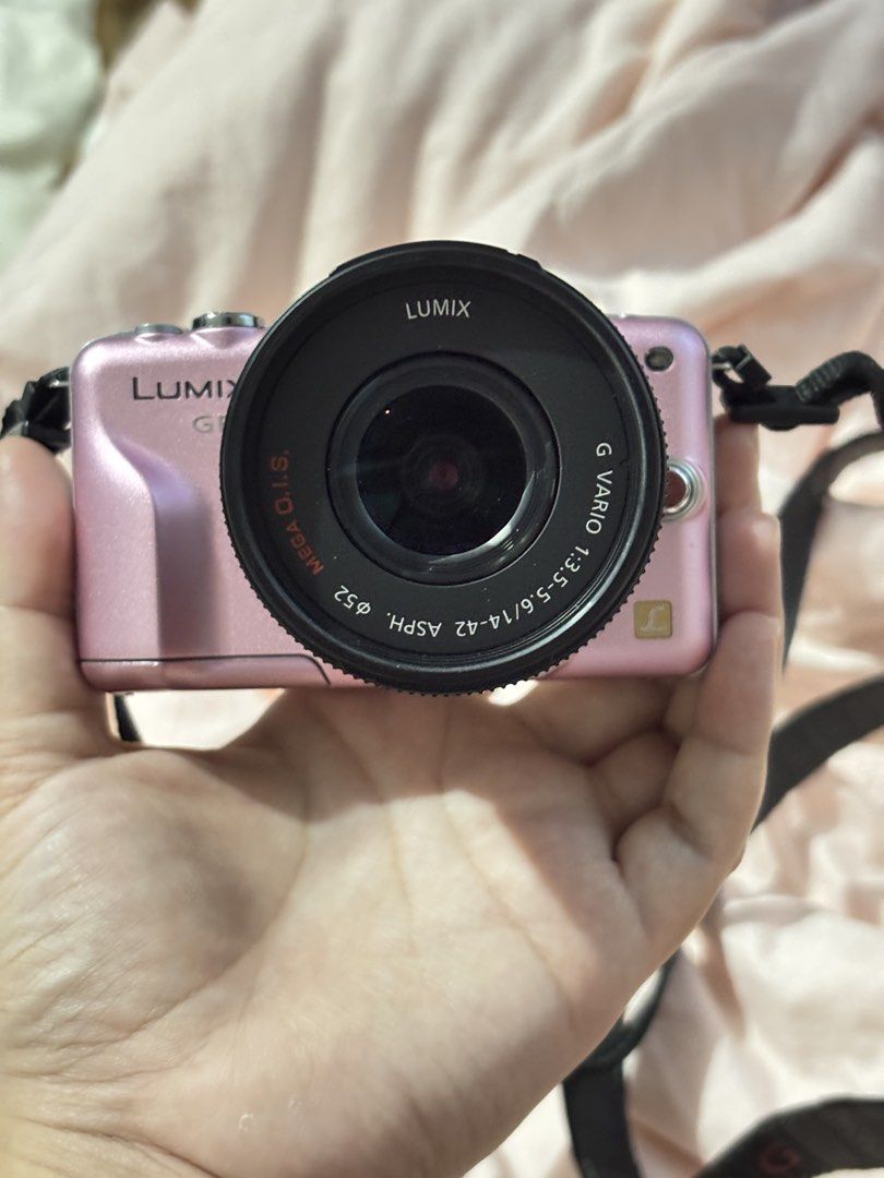 Panasonic Lumix GF3 Mirrorless Camera with Kit Lens (Category: Cameras) located in Davao. Submitted by pammy_swiss (Listing ID 1426455281, Image 3). Description: Panasonic Lumix DMC-GF3 Baby Pink 🎀 — ultra-compact body mirrorless camera — Lumix G Vario 14-22mm Mark II kit lens w/ OIS for steady shots — 3.0 inch touchscreen — 1080p full HD video w/ dedicated movie button — built-in pop-up flash — micro four thirds mount- compatible w/ hundreds of