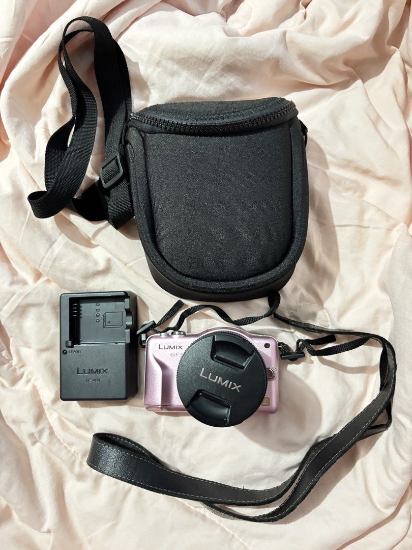 Panasonic Lumix GF3 Mirrorless Camera with Kit Lens (Category: Cameras) located in Davao. Submitted by pammy_swiss (Listing ID 1426455281, Image 2). Description: Panasonic Lumix DMC-GF3 Baby Pink 🎀 — ultra-compact body mirrorless camera — Lumix G Vario 14-22mm Mark II kit lens w/ OIS for steady shots — 3.0 inch touchscreen — 1080p full HD video w/ dedicated movie button — built-in pop-up flash — micro four thirds mount- compatible w/ hundreds of