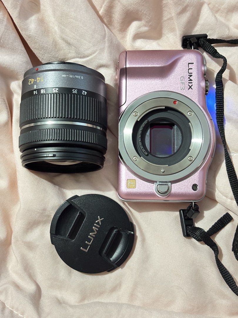 Panasonic Lumix GF3 Mirrorless Camera with Kit Lens (Category: Cameras) located in Davao. Submitted by pammy_swiss (Listing ID 1426455281, Image 1). Description: Panasonic Lumix DMC-GF3 Baby Pink 🎀 — ultra-compact body mirrorless camera — Lumix G Vario 14-22mm Mark II kit lens w/ OIS for steady shots — 3.0 inch touchscreen — 1080p full HD video w/ dedicated movie button — built-in pop-up flash — micro four thirds mount- compatible w/ hundreds of