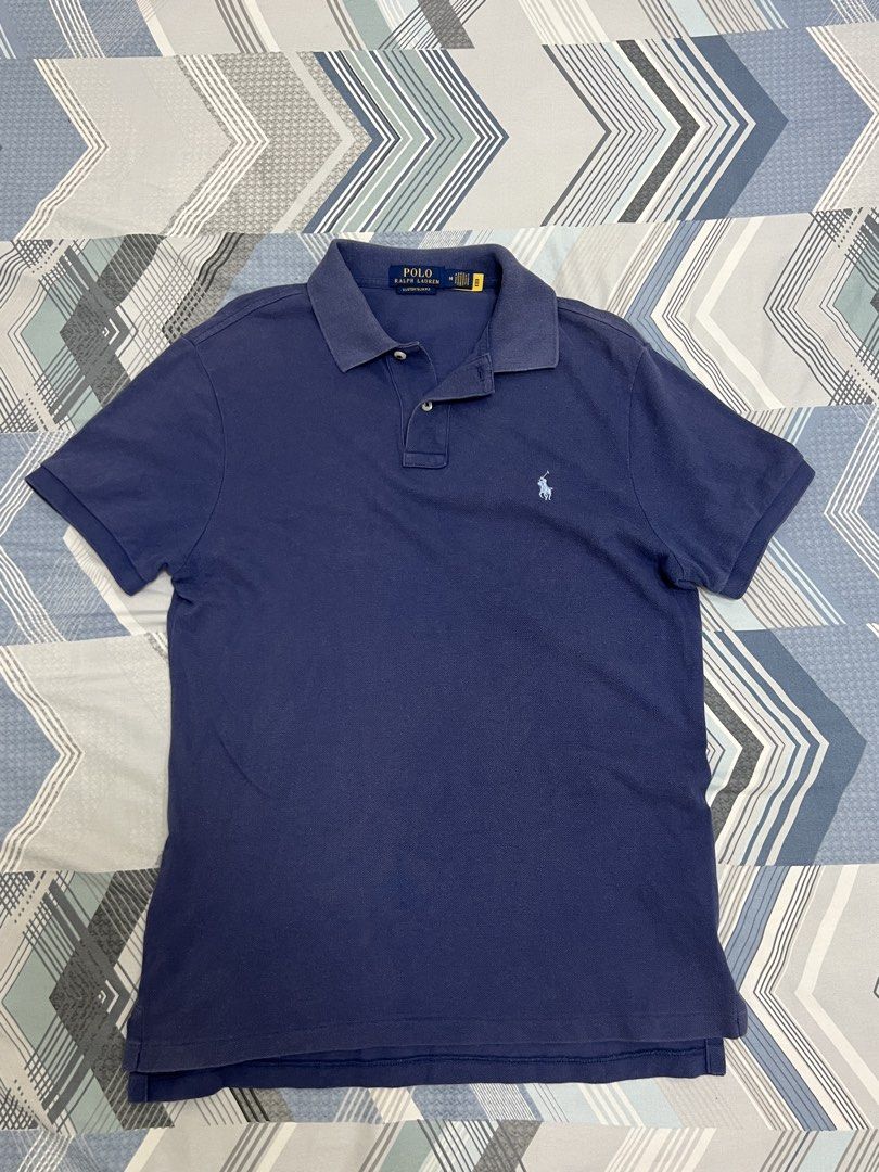 Polo Ralph Lauren Polo Shirt (Authentic) (Category: Tshirts & Polo Shirts ) located in Manila. Submitted by rackarchives_ (Listing ID 1426438237, Image 1). Description: (Authentic) Ralph Lauren Blue Polo Shirt Length: 26 Width: 18 Issue: None Condition: Good.