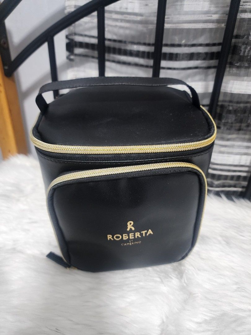 Roberta Cosmetic Bag with Mirror (Category: Luxury Bags & Wallets) located in Paranaque City. Submitted by rizasauthenticitems (Listing ID 1426556253, Image 1). Description: Black cosmetic bag by Roberta. Features a gold zipper and a handle for easy carrying. The bag has a mesh pocket and slots for brushes. It also includes a mirror inside..