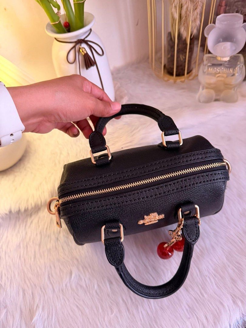 Rowan Coach Mini Cylinder Bag with Cherry Charm (Category: Luxury Bags & Wallets) located in Quezon City. Submitted by spikesforhope (Listing ID 1426552184, Image 3). Description: Rowan Coach 😍🖤🍒 made in vietnam ✔️ ykk zip/iteketa ✔️ Excellent condition ✔️ Dm for inquiries ❗️.