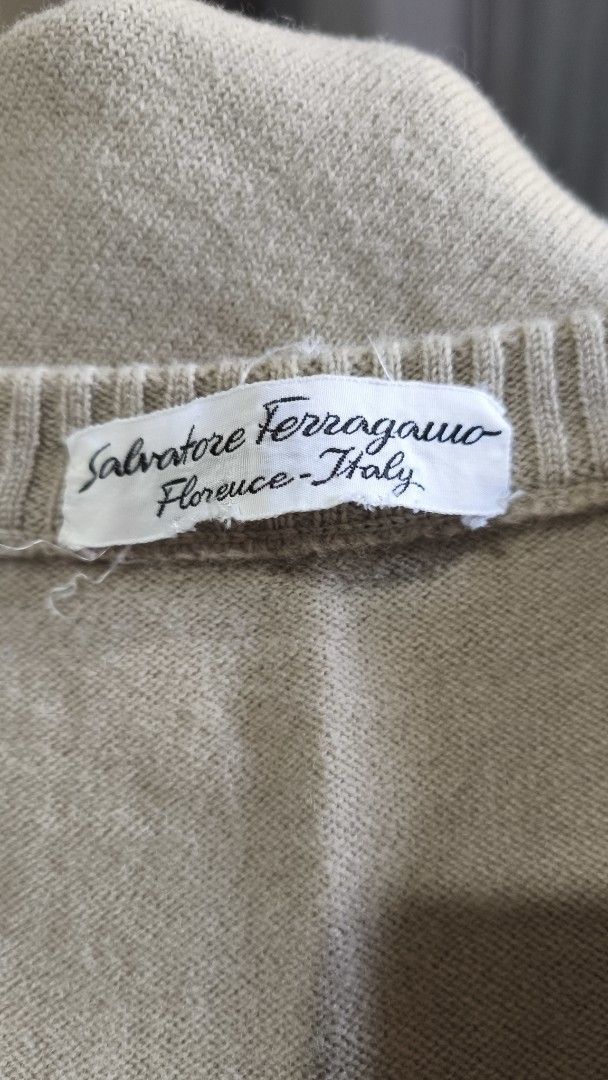 Salvatore Ferragamo V-Neck Vest (Category: Vests) located in Quezon City. Submitted by huwanathriftapparel (Listing ID 1426487065, Image 2). Description: Authentic Salvatore Ferragamo vest. Features a V-neck design with a striped detail at the bottom. The vest is sleeveless and has a neutral color. Made in Italy. A classic piece that can be styled in many ways..