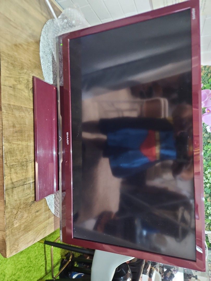 Sharp TV (Category: TV) located in Singapore. Submitted by hotstuffing (Listing ID 1426423686, Image 1). Description: - A basic LCD tv Burgundy frame and stand - Suitable for living room or bedroom - Perfect for movies, shows, and games.