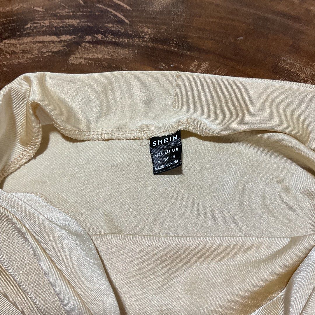 Shein Body Con Ruched Skirt (Category: Skirts) located in Bacolod City. Submitted by itsmelourd (Listing ID 1426478668, Image 3). Description: - ruched design - neutral beige color - see photo for inspo - flattering and body hugging.