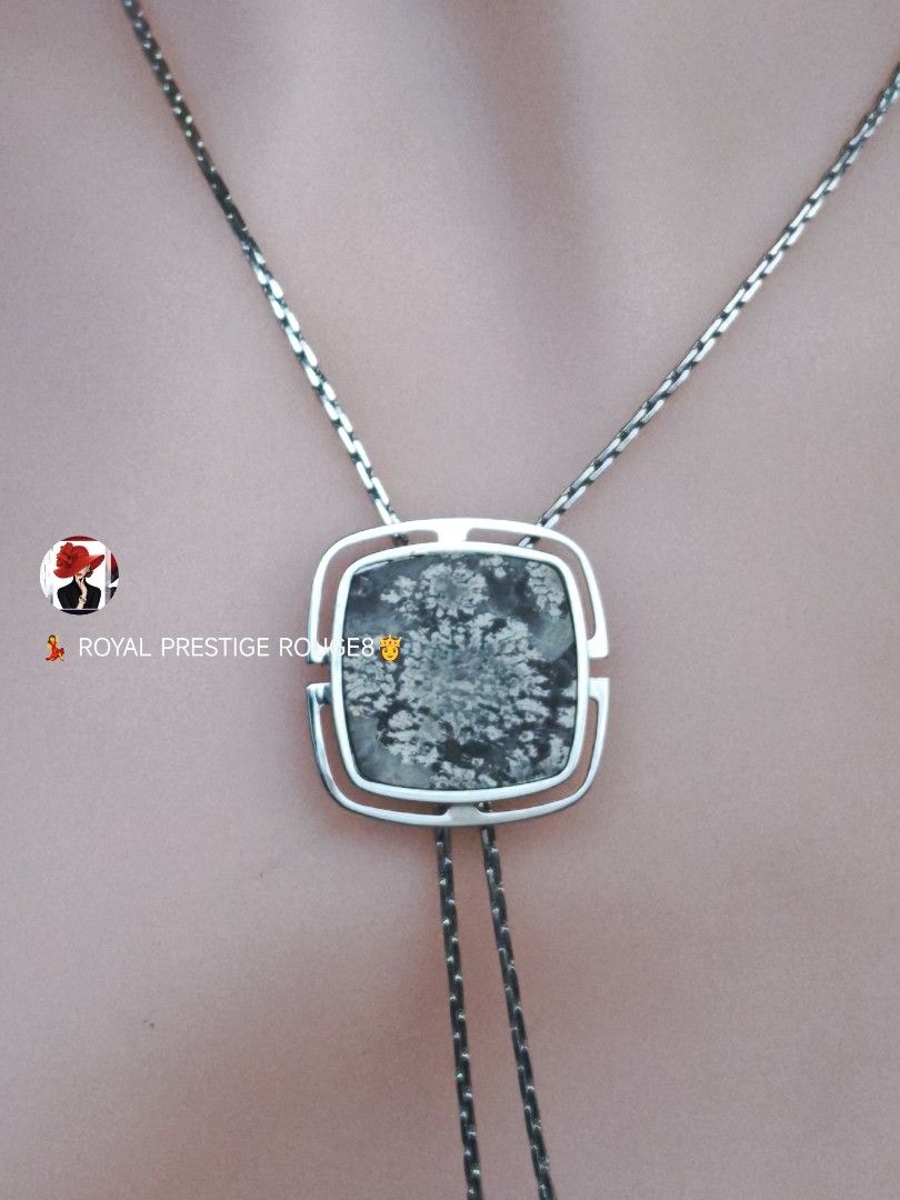 Snowflake Picture Agate Stone Pendant Necklace (Category: Necklaces) located in Baguio. Submitted by royalprestigerouge (Listing ID 1426447076, Image 2). Description: Elegant necklace featuring a square pendant with a snowflake stone design. The pendant is encased in a silver-toned frame and hangs from a delicate chain. The necklace has a unique bolo-style design with a second chain that can be adjusted. A stylish accessory for any outfit..