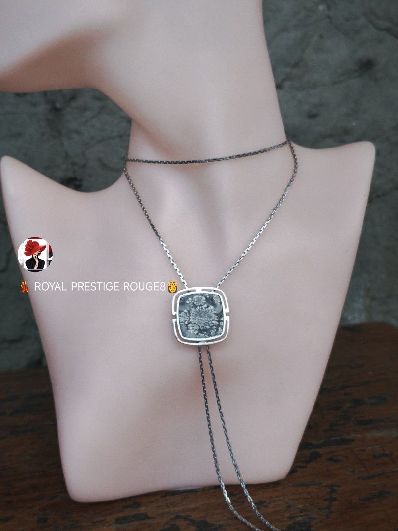 Snowflake Picture Agate Stone Pendant Necklace (Category: Necklaces) located in Baguio. Submitted by royalprestigerouge (Listing ID 1426447076, Image 1). Description: Elegant necklace featuring a square pendant with a snowflake stone design. The pendant is encased in a silver-toned frame and hangs from a delicate chain. The necklace has a unique bolo-style design with a second chain that can be adjusted. A stylish accessory for any outfit..