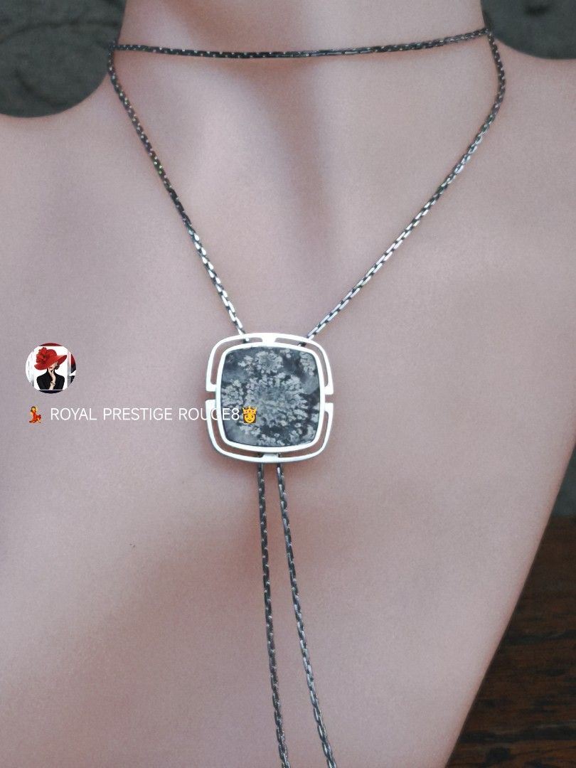 Snowflake Picture Agate Stone Pendant Necklace (Category: Necklaces) located in Baguio. Submitted by royalprestigerouge (Listing ID 1426447076, Image 3). Description: Elegant necklace featuring a square pendant with a snowflake stone design. The pendant is encased in a silver-toned frame and hangs from a delicate chain. The necklace has a unique bolo-style design with a second chain that can be adjusted. A stylish accessory for any outfit..