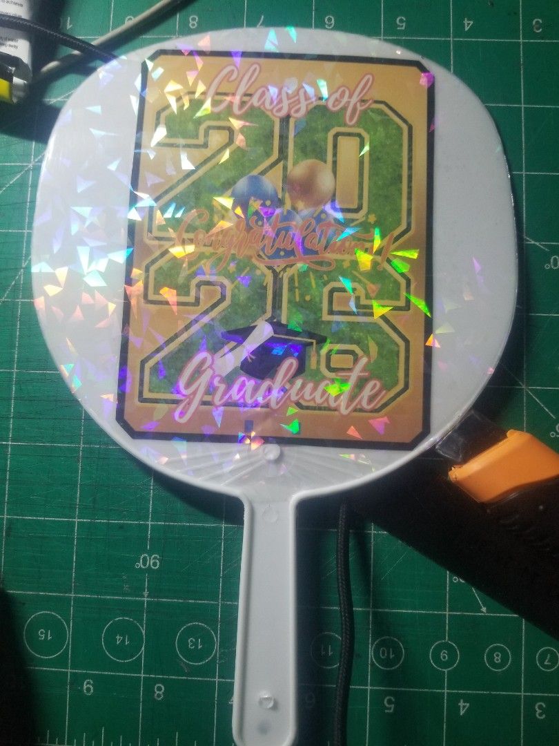 Souvenir Graduation Fan (Category: Fans) located in Dasmarinas. Submitted by makekiel0918 (Listing ID 1426572541, Image 3). Description: 🎓 GRADUATION FAN – Perfect for Graduation Day! 🎓 Celebrate your graduate with this cute Batch 2026 Graduation Fan! Perfect souvenir and useful to keep cool during the ceremony. ✨ Details: • Lightweight handheld fan • Cute graduation design • Perfect for graduation photos & gifts • Ready for Batch 2026 💰 Price