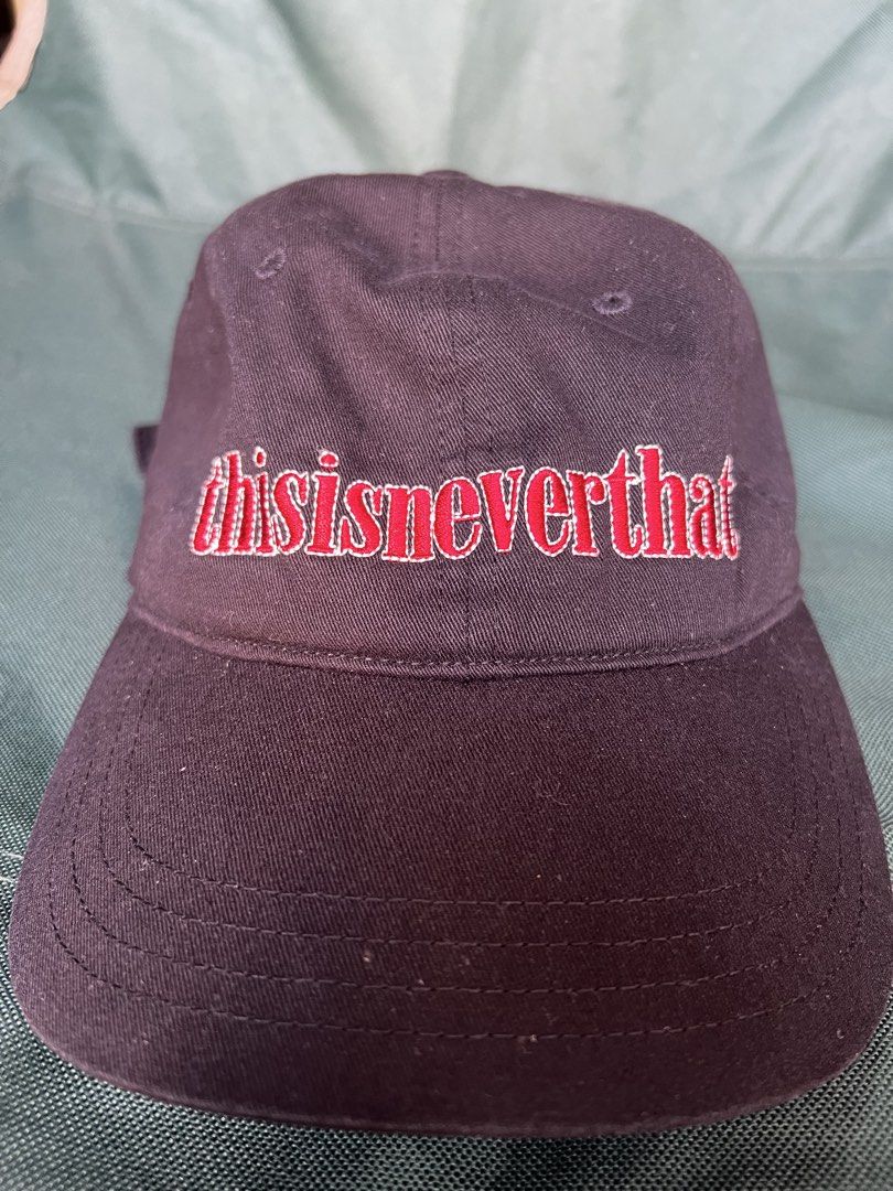 thisisneverthat Cap (Category: Caps & Hats) located in San Francisco. Submitted by ranjugals (Listing ID 1426454818, Image 1). Description: Black cap from thisisneverthat. Features the brand's logo embroidered in red on the front. Adjustable strap at the back with the brand's logo. The tag indicates the cap is made in Vietnam..