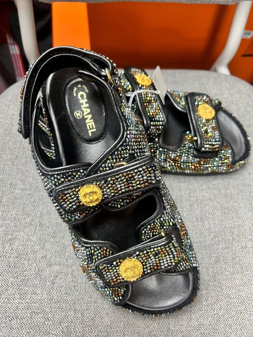 Unused Chanel Embellished Sandals (Category: Sneakers & Footwear) located in Quezon City. Submitted by hellopatchi (Listing ID 1426471879, Image 3). Description: With dust bag included Authentic Chanel sandals featuring a multi-colored embellished design. These sandals have adjustable straps and the iconic Chanel logo on the insole and the straps. The soles are black. The sandals have gold-tone hardware..