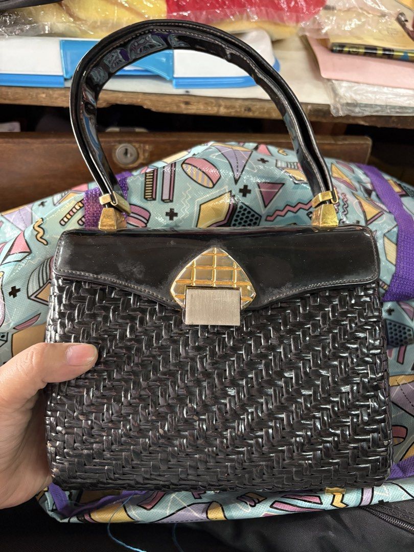 Vintage Koret Black Woven Handbag (Category: Tote Bags) located in Rizal. Submitted by heyninya (Listing ID 1426480869, Image 1). Description: - Koret black handbag - Woven design with glossy black finish - Gold-toned clasp and handle accents - Yellow interior lining - Features a small interior pocket - Authentic Koret bag Have sign of used na.hardware fadings but super good condition. 💖.