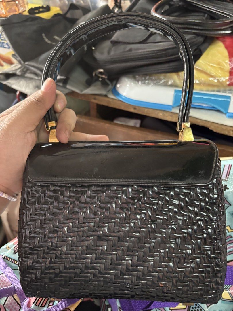 Vintage Koret Black Woven Handbag (Category: Tote Bags) located in Rizal. Submitted by heyninya (Listing ID 1426480869, Image 2). Description: - Koret black handbag - Woven design with glossy black finish - Gold-toned clasp and handle accents - Yellow interior lining - Features a small interior pocket - Authentic Koret bag Have sign of used na.hardware fadings but super good condition. 💖.