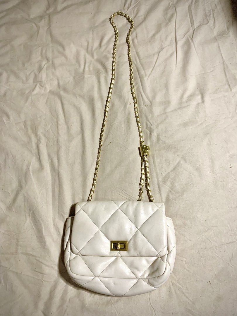 White Quilted Shoulder Bag with Gold Chain (Category: Shoulder Bags) located in Quezon City. Submitted by echojao (Listing ID 1426455350, Image 1). Description: Decluttering preloved bags. Pricing according to quality or issues. Issues are shown on the pictures. Please be mindful before messaging. .