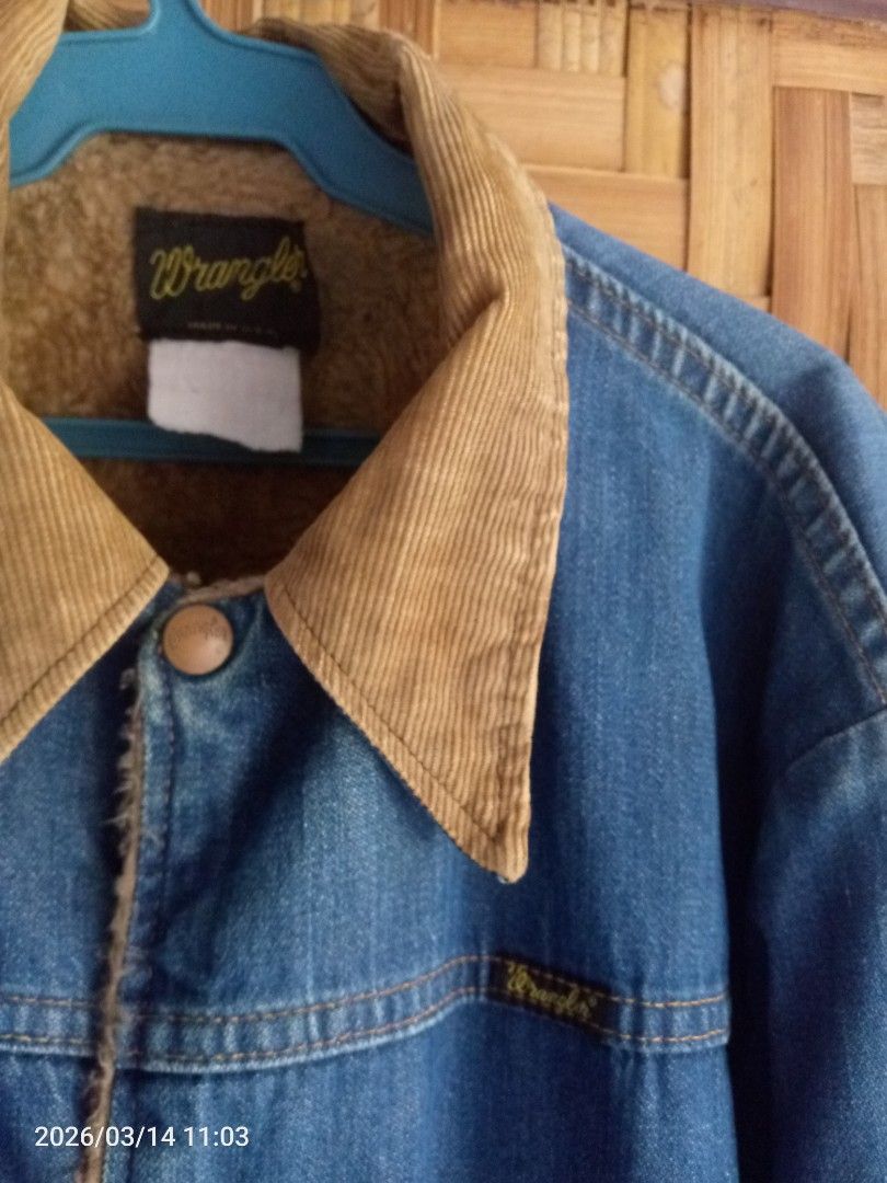 Wrangler Denim Jacket with Corduroy Collar (Category: Coats, Jackets and Outerwear) located in Trinidad. Submitted by i-thifthing-shop (Listing ID 1426410951, Image 2). Description: Vintage Wrangler denim jacket. Features a corduroy collar and button closure. Includes two front pockets and patches on the elbows. The jacket has a Wrangler logo on the chest. Made in the U.S.A..