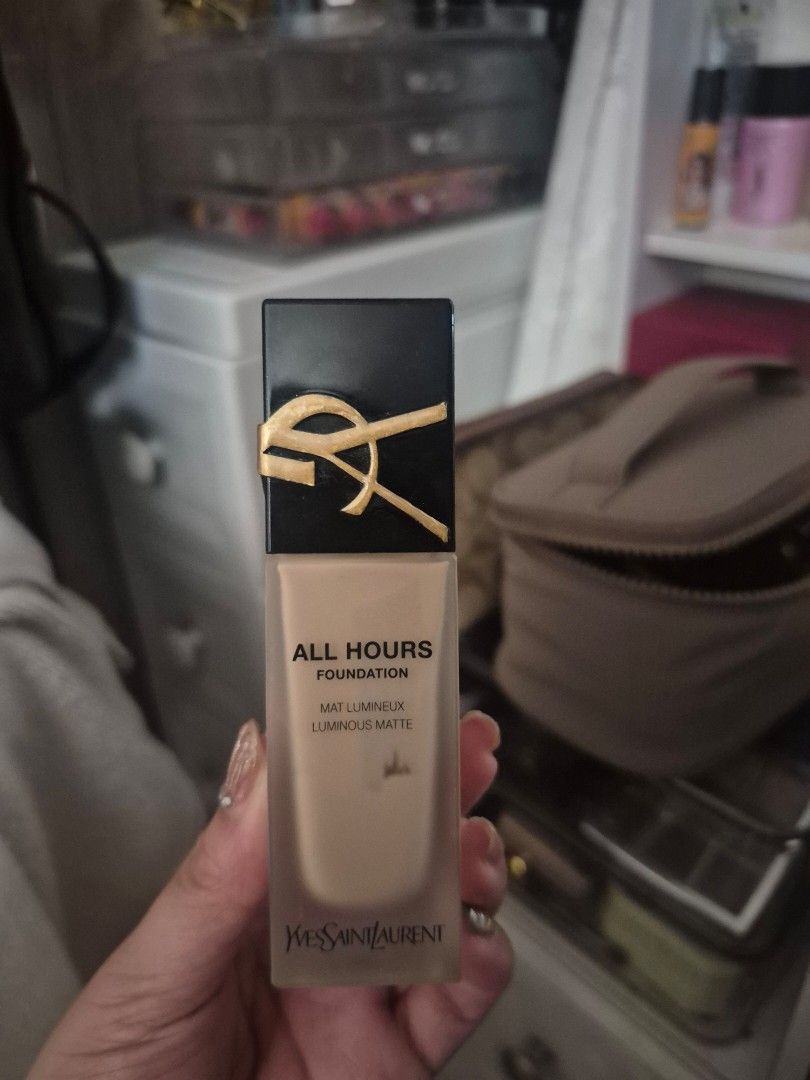 YSL All Hours Foundation (Category: Makeup) located in Manila. Submitted by declutterwithpeanut (Listing ID 1426435063, Image 1). Description: Around 70-80% YSL All Hours Foundation. This foundation is in a clear bottle with a black cap featuring the YSL logo. It is a matte foundation. The bottle contains a light beige foundation. The product is in a rectangular bottle..