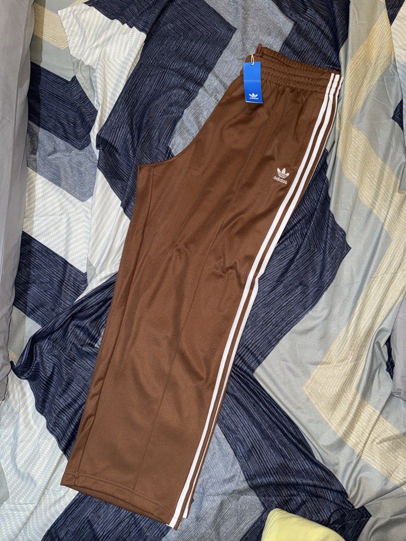 Adidas Firebird Brown Track Pants XL (Category: Joggers) located in Manila. Submitted by alassitems (Listing ID 1426728388, Image 2). Description: Adidas Firebird Track Pants Bought from CA🇨🇦 ✅ Brand New ✅ Baggy Fit ✅ Mens XL ✅ Brown Note: No Issues. 5k SRP sa mall. RFS: Extra Message for more info! 📍Tondo, Manila 🛵 Ship via Couriers.