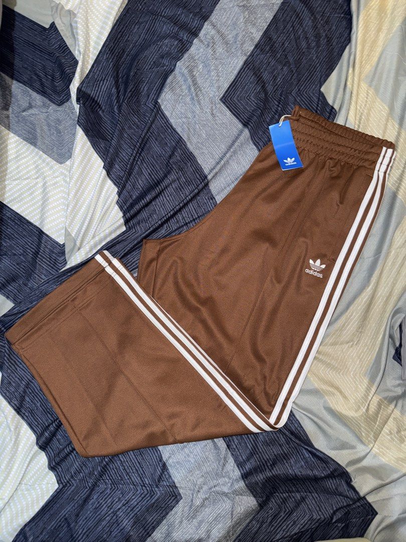 Adidas Firebird Brown Track Pants XL (Category: Joggers) located in Manila. Submitted by alassitems (Listing ID 1426728388, Image 3). Description: Adidas Firebird Track Pants Bought from CA🇨🇦 ✅ Brand New ✅ Baggy Fit ✅ Mens XL ✅ Brown Note: No Issues. 5k SRP sa mall. RFS: Extra Message for more info! 📍Tondo, Manila 🛵 Ship via Couriers.