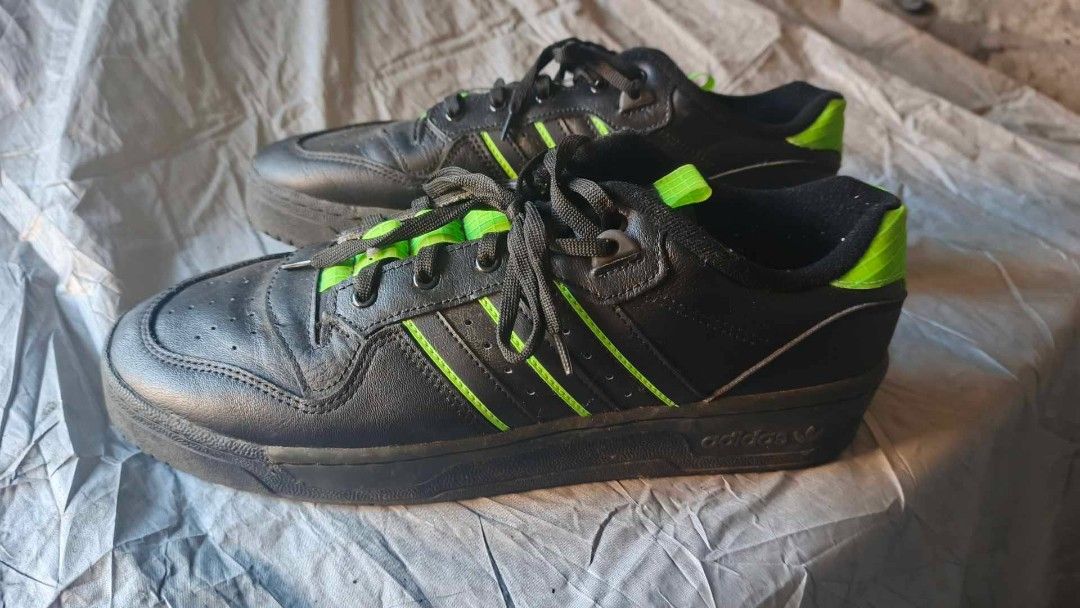 Adidas Rivalry shoes (Category: Sneakers) located in Bacoor. Submitted by punkzappa18 (Listing ID 1426698406, Image 1). Description: For sale Preloved original shoes In very good condition Mga 4 times lang nagamit No box dahil Padala from abroad Adidas Rivalry Low Black Green Size 10.5 mens 900 pesos na lang Ilang beses lang nagamit dahil masikip kaysa ma stock benta n lang Selling as is lang Pede nyo icheck para mas ok n Makita nyo. Pede din swa