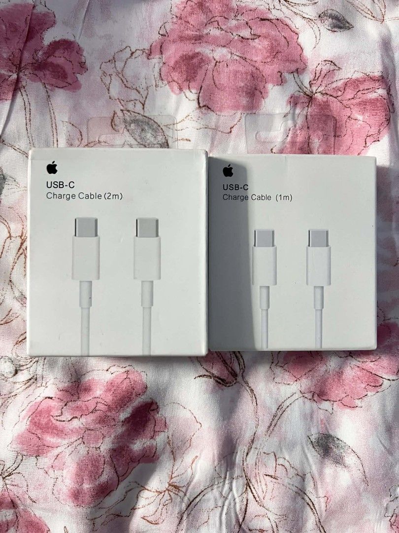Apple USB-C Charge Cables (1m and 2m) (Category: Chargers & Cables) located in Manila. Submitted by onlineshopping22 (Listing ID 1426600574, Image 1). Description: $ 500 (2M ) - A side-by-side view of two original Apple USB-C Charge Cable retail boxes. - The set includes one 1-meter cable and one 2-meter cable, both featuring USB-C connectors on both ends for high-speed charging and data syncing across Mac, iPad, and iPhone models..