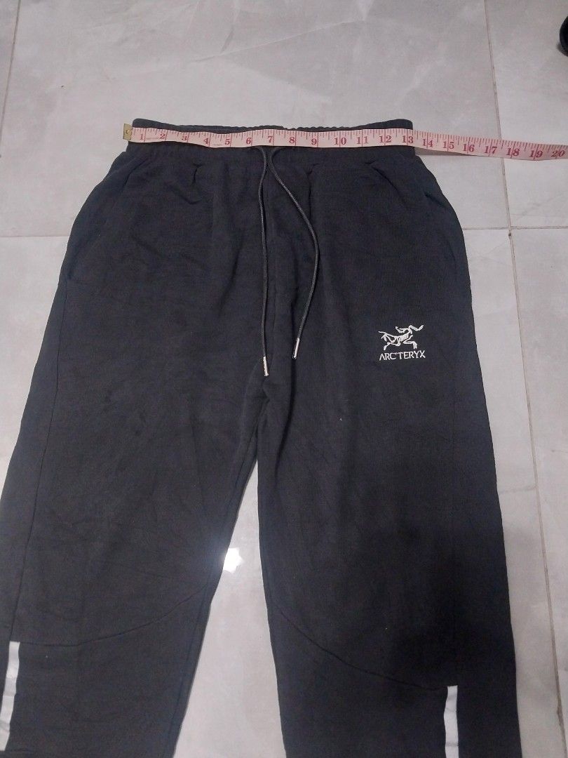 Arc'teryx Veilance Black Pants (Category: Jeans) located in Malaybalay. Submitted by markdaumar08466 (Listing ID 1426644319, Image 2). Description: Black Arc'teryx Veilance pants. Features a drawstring waist and reflective details. The pants have a small logo on the front. Size S. Made in China..